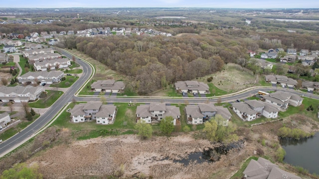 bird's eye view featuring a water view and a residential view