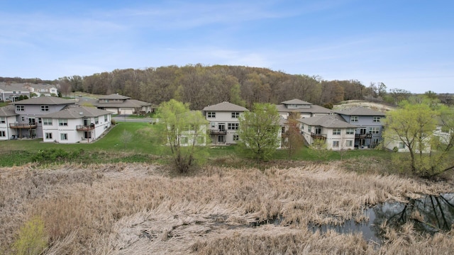 birds eye view of property with a residential view