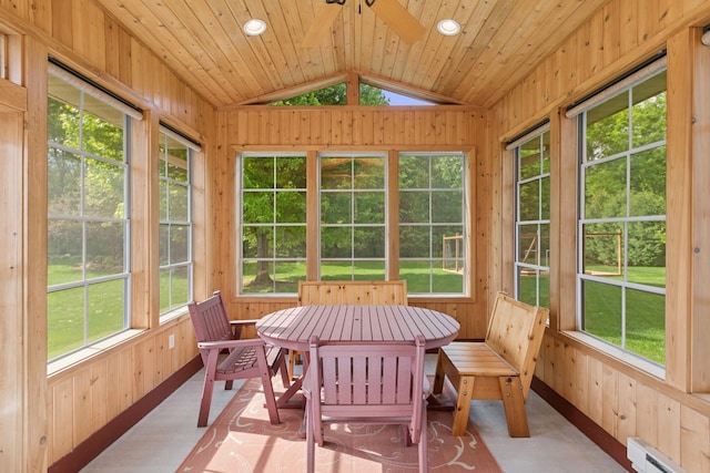 813 Quie Ln, Northfield, MN 55057 - sunroom featuring a baseboard radiator, wood walls, and vaulted ceiling