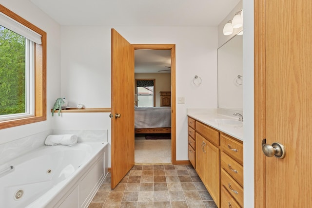 813 Quie Ln, Northfield, MN 55057 - full bathroom with connected bathroom, healthy amount of natural light, vanity, and a jetted tub