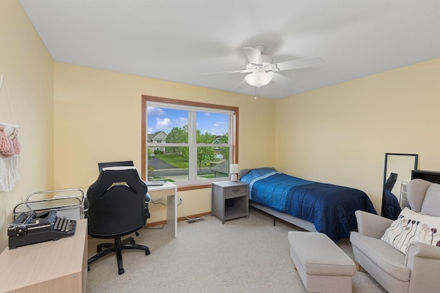 813 Quie Ln, Northfield, MN 55057 - bedroom featuring an office area, light carpet, a ceiling fan, and baseboards