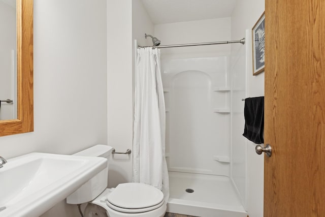813 Quie Ln, Northfield, MN 55057 - bathroom with a stall shower, toilet, and a sink