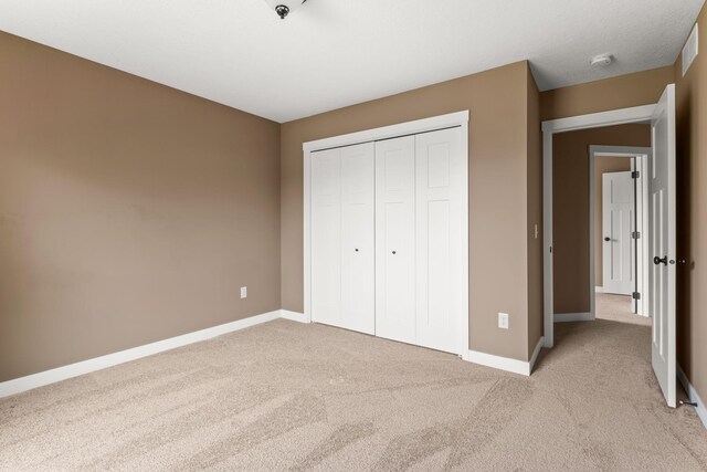 7387 Old Mill Rd, Centerville, MN 55038 - unfurnished bedroom with light carpet and a closet