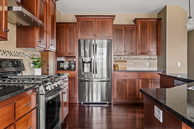 7387 Old Mill Rd, Centerville, MN 55038 - kitchen featuring stainless steel appliances, wall chimney range hood, dark wood-style floors, dark stone countertops, and tasteful backsplash