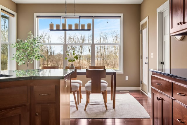 7387 Old Mill Rd, Centerville, MN 55038 - dining room featuring baseboards and dark wood-type flooring