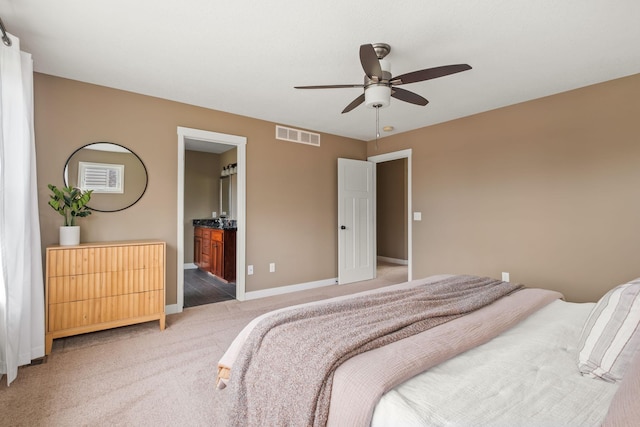 7387 Old Mill Rd, Centerville, MN 55038 - bedroom with light colored carpet, ceiling fan, and ensuite bathroom