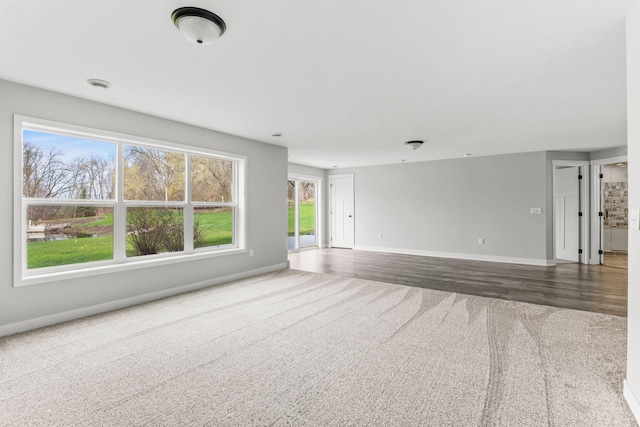 7387 Old Mill Rd, Centerville, MN 55038 - unfurnished room featuring carpet floors and baseboards