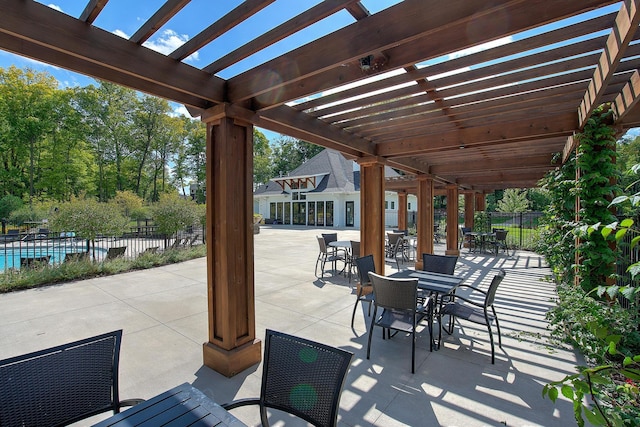 view of patio with fence, a pergola, and outdoor dining area