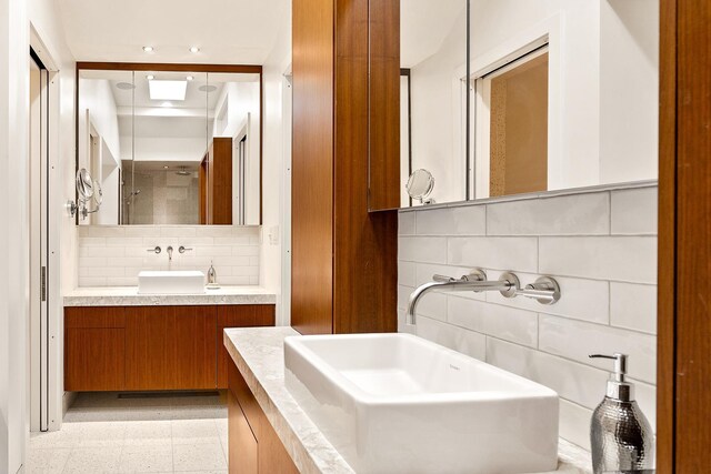 4721 Lake Harriet Pkwy, Minneapolis, MN 55419 - full bathroom featuring decorative backsplash, tile walls, recessed lighting, a shower with door, and vanity