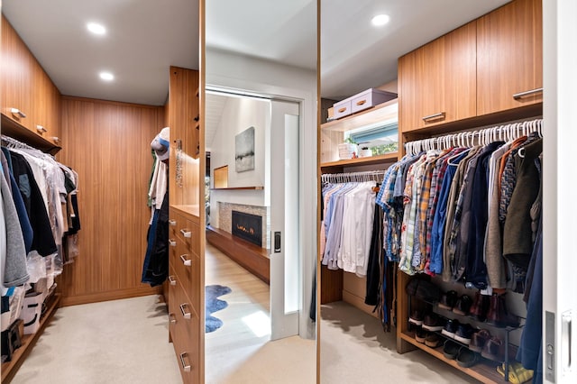 4721 Lake Harriet Pkwy, Minneapolis, MN 55419 - walk in closet with light colored carpet and a warm lit fireplace