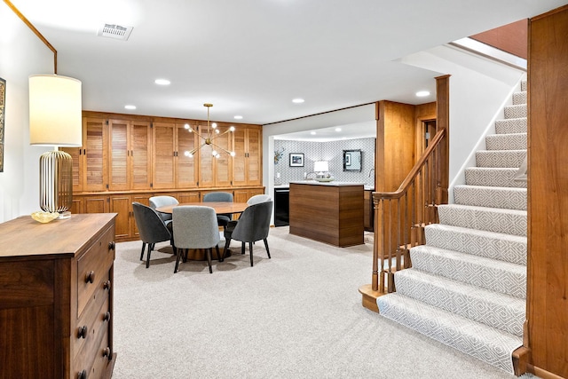 4721 Lake Harriet Pkwy, Minneapolis, MN 55419 - dining room featuring light carpet, stairs, recessed lighting, and a chandelier