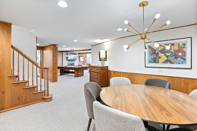 4721 Lake Harriet Pkwy, Minneapolis, MN 55419 - dining room with light colored carpet, recessed lighting, wooden walls, stairway, and a chandelier
