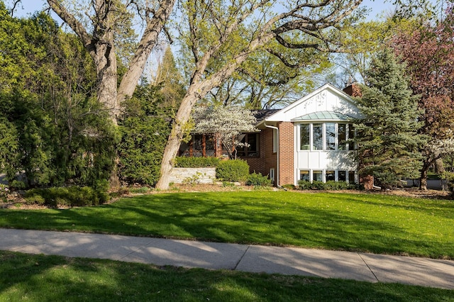 4721 Lake Harriet Pkwy, Minneapolis, MN 55419 - view of front facade featuring brick siding, a chimney, and a front yard