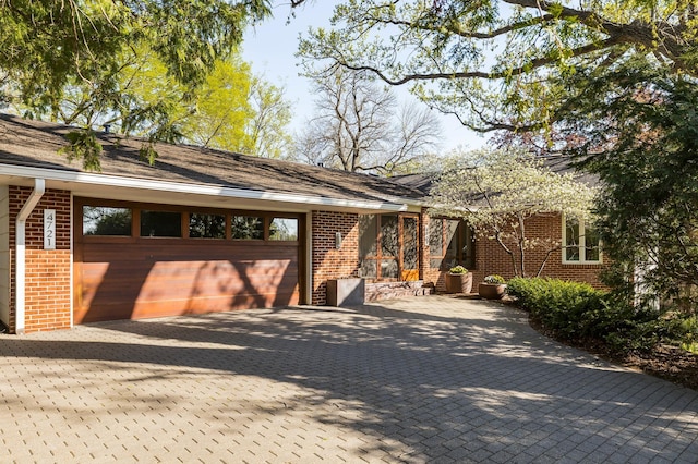 4721 Lake Harriet Pkwy, Minneapolis, MN 55419 - view of front of home featuring brick siding, driveway, and an attached garage