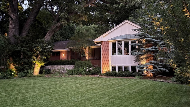 4721 Lake Harriet Pkwy, Minneapolis, MN 55419 - view of front of house with brick siding, board and batten siding, and a front lawn