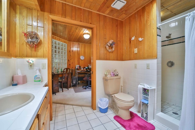 7717 Lake May Rd NW, Walker, MN 56433 - full bath featuring wood ceiling, tile patterned floors, a shower stall, vanity, and toilet
