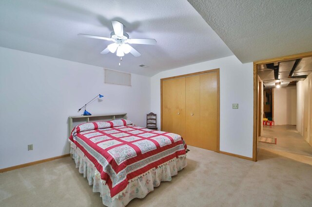 7717 Lake May Rd NW, Walker, MN 56433 - bedroom with carpet floors, baseboards, a ceiling fan, a closet, and a textured ceiling