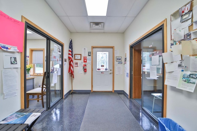 7717 Lake May Rd NW, Walker, MN 56433 - doorway to outside with a paneled ceiling, speckled floor, and baseboards
