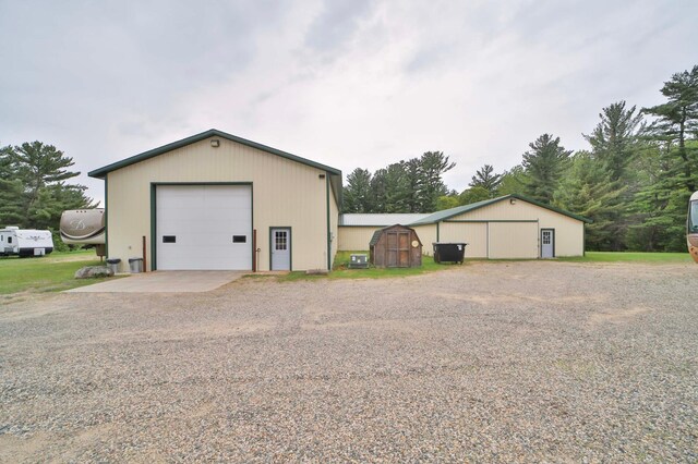 7717 Lake May Rd NW, Walker, MN 56433 - detached garage featuring gravel driveway