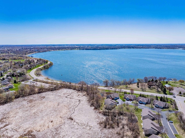 birds eye view of property featuring a water view and a residential view