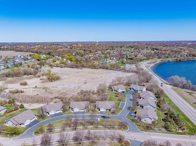 aerial view featuring a water view and a residential view