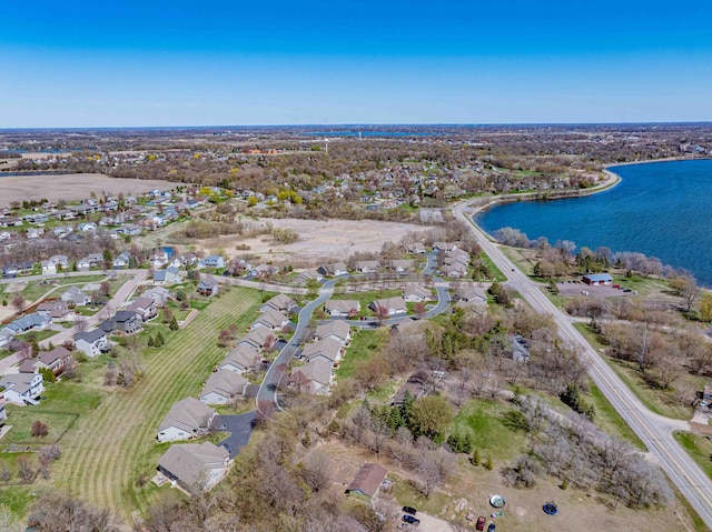 birds eye view of property featuring a water view and a residential view