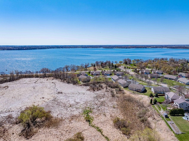 aerial view with a water view and a residential view