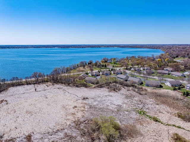 bird's eye view featuring a water view and a residential view