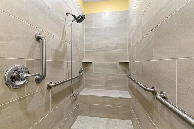 full bath featuring a tile shower