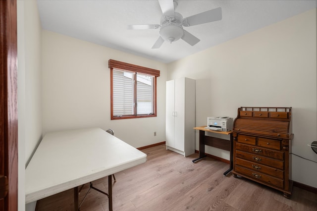 office with ceiling fan, baseboards, and wood finished floors