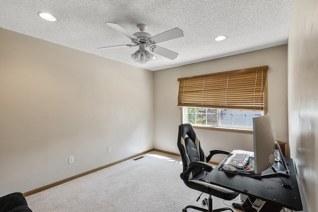 office space featuring carpet floors, a ceiling fan, baseboards, recessed lighting, and a textured ceiling