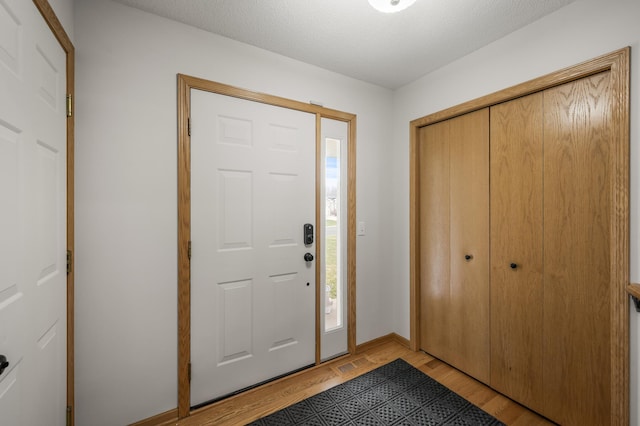 664 Highland Trl, Lino Lakes, MN 55014 - entrance foyer with light wood-style flooring and baseboards
