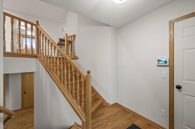 664 Highland Trl, Lino Lakes, MN 55014 - stairs featuring wood finished floors