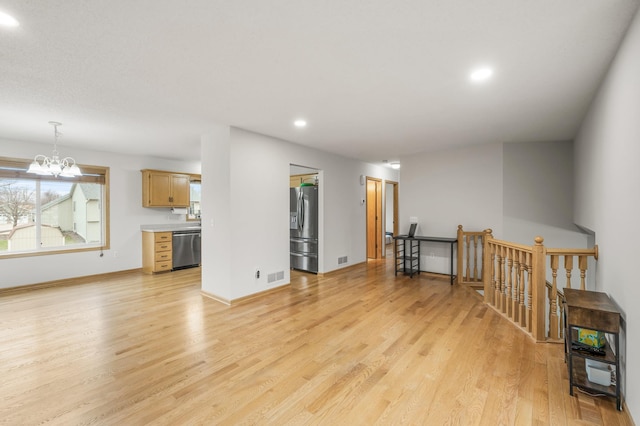 664 Highland Trl, Lino Lakes, MN 55014 - spare room featuring recessed lighting, light wood-style floors, and a chandelier