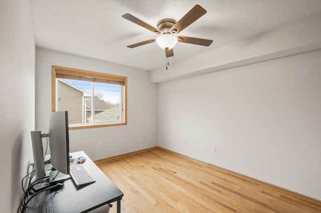 664 Highland Trl, Lino Lakes, MN 55014 - unfurnished office with light wood-type flooring, a ceiling fan, and a textured ceiling