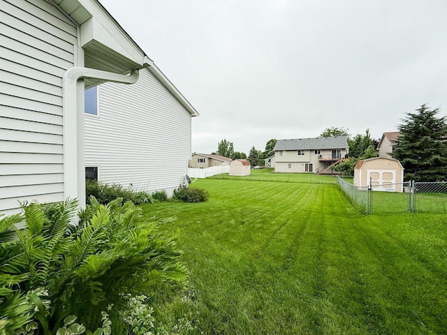 664 Highland Trl, Lino Lakes, MN 55014 - view of yard featuring a storage unit