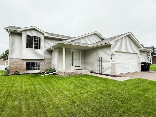 664 Highland Trl, Lino Lakes, MN 55014 - split level home featuring brick siding, an attached garage, a front yard, and concrete driveway