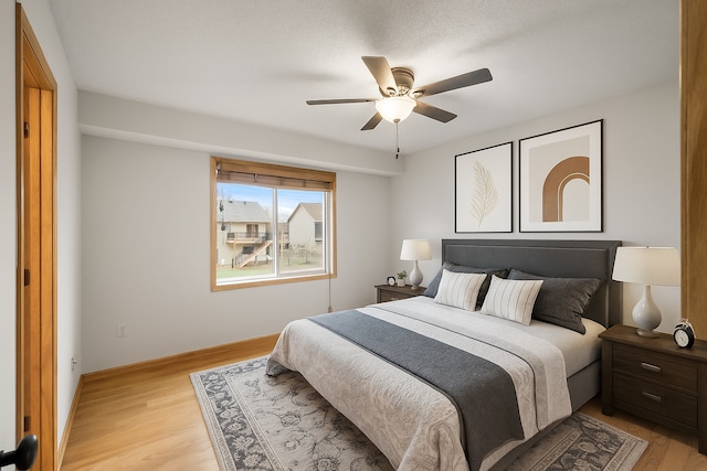 664 Highland Trl, Lino Lakes, MN 55014 - bedroom featuring light wood-style flooring and ceiling fan
