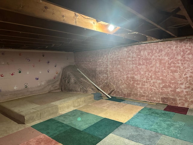 unfinished basement with tile patterned floors