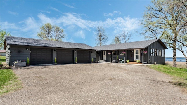 7355 Little Mary Cir SW, Alexandria, MN 56308 - ranch-style house featuring a porch, driveway, and a water view