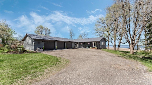 7355 Little Mary Cir SW, Alexandria, MN 56308 - ranch-style house with asphalt driveway, a garage, and a front yard