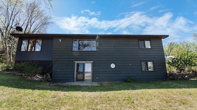 7355 Little Mary Cir SW, Alexandria, MN 56308 - back of house featuring a yard