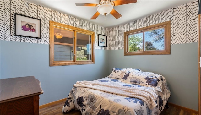 7355 Little Mary Cir SW, Alexandria, MN 56308 - bedroom featuring wallpapered walls, wood finished floors, baseboards, and a ceiling fan