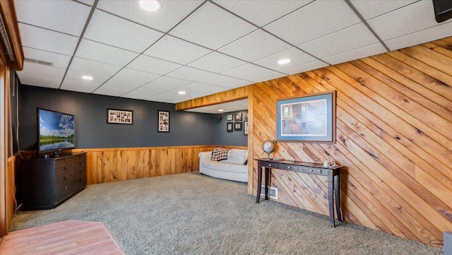 7355 Little Mary Cir SW, Alexandria, MN 56308 - living area featuring carpet floors, recessed lighting, wood walls, wainscoting, and a paneled ceiling