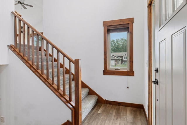 116 Wheat Field Ln, New Richmond, WI 54017 - stairway featuring wood finished floors and ceiling fan