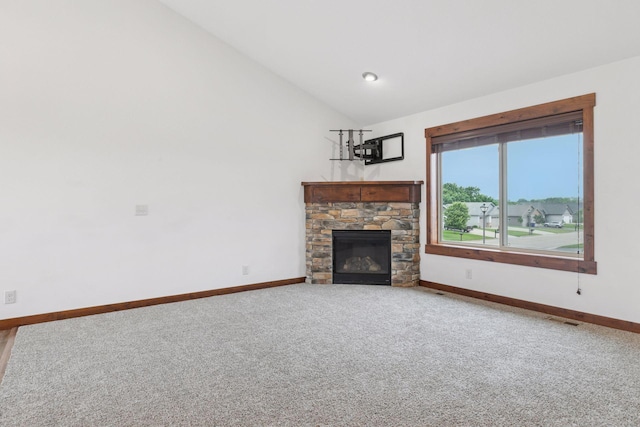 116 Wheat Field Ln, New Richmond, WI 54017 - unfurnished living room with vaulted ceiling, carpet, and a fireplace