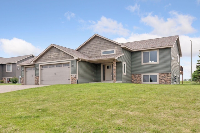 116 Wheat Field Ln, New Richmond, WI 54017 - craftsman house featuring stone siding, an attached garage, a front lawn, driveway, and a shingled roof