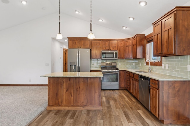 116 Wheat Field Ln, New Richmond, WI 54017 - kitchen with appliances with stainless steel finishes, a center island, dark wood-type flooring, recessed lighting, and hanging light fixtures