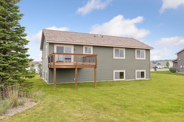 116 Wheat Field Ln, New Richmond, WI 54017 - back of house featuring a yard, a shingled roof, and a wooden deck