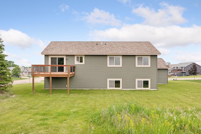 116 Wheat Field Ln, New Richmond, WI 54017 - rear view of property with a lawn, a shingled roof, and a deck